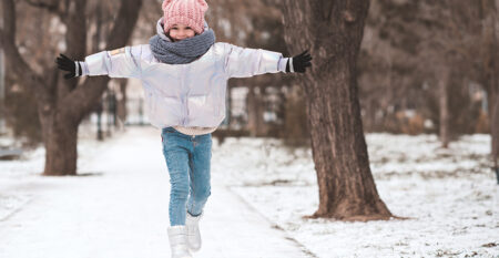 happy-kid-girl-having-fun-with-snow-park
